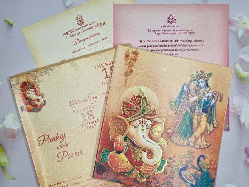 Radha Krishna With Peacocks Themed Orange Ganesha Wedding Invitation Card